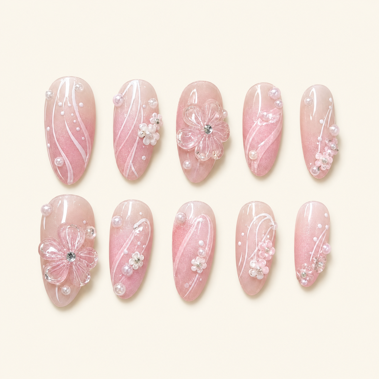 Blush floral press-on nails on ivory background