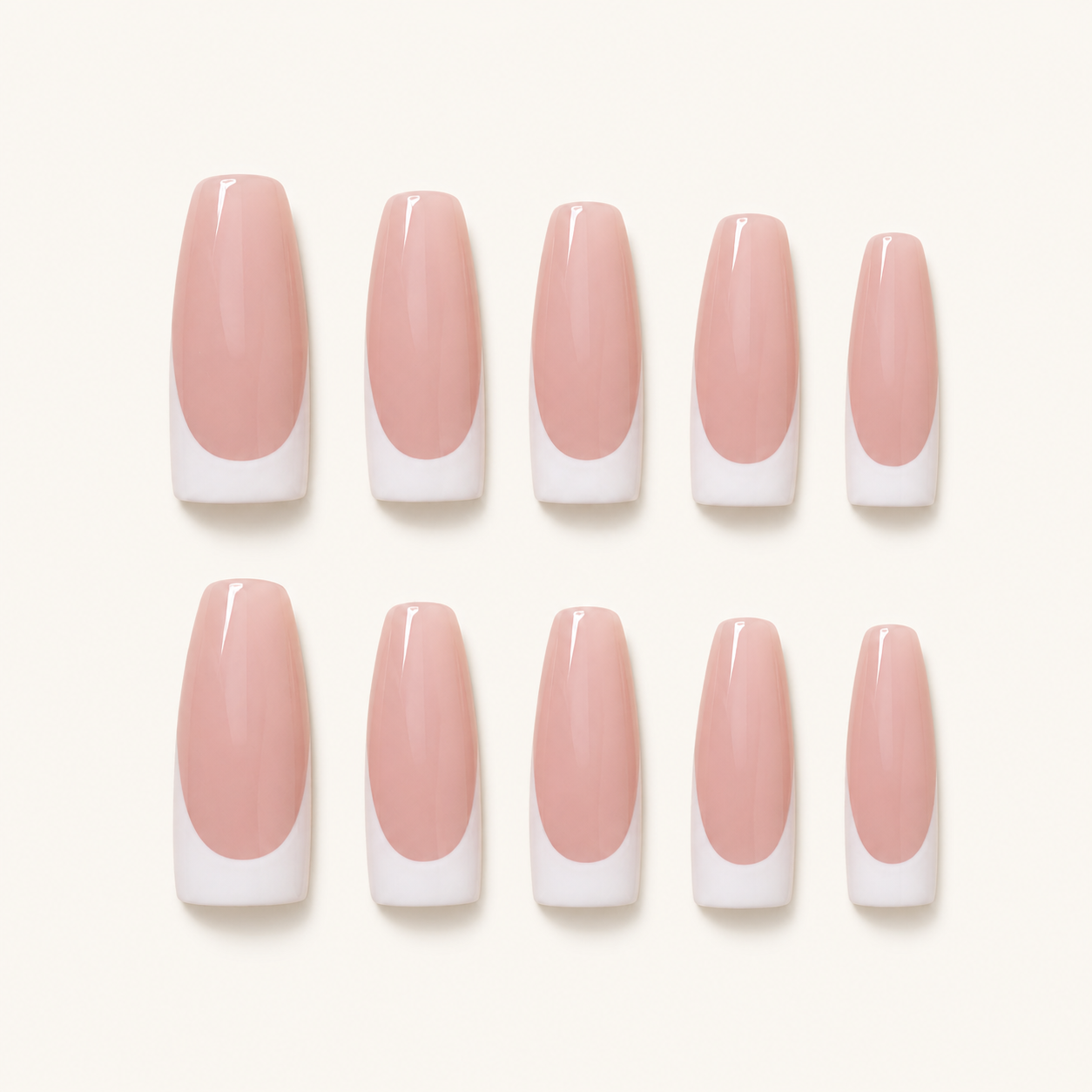 Nude pink white French press-on nails on ivory background