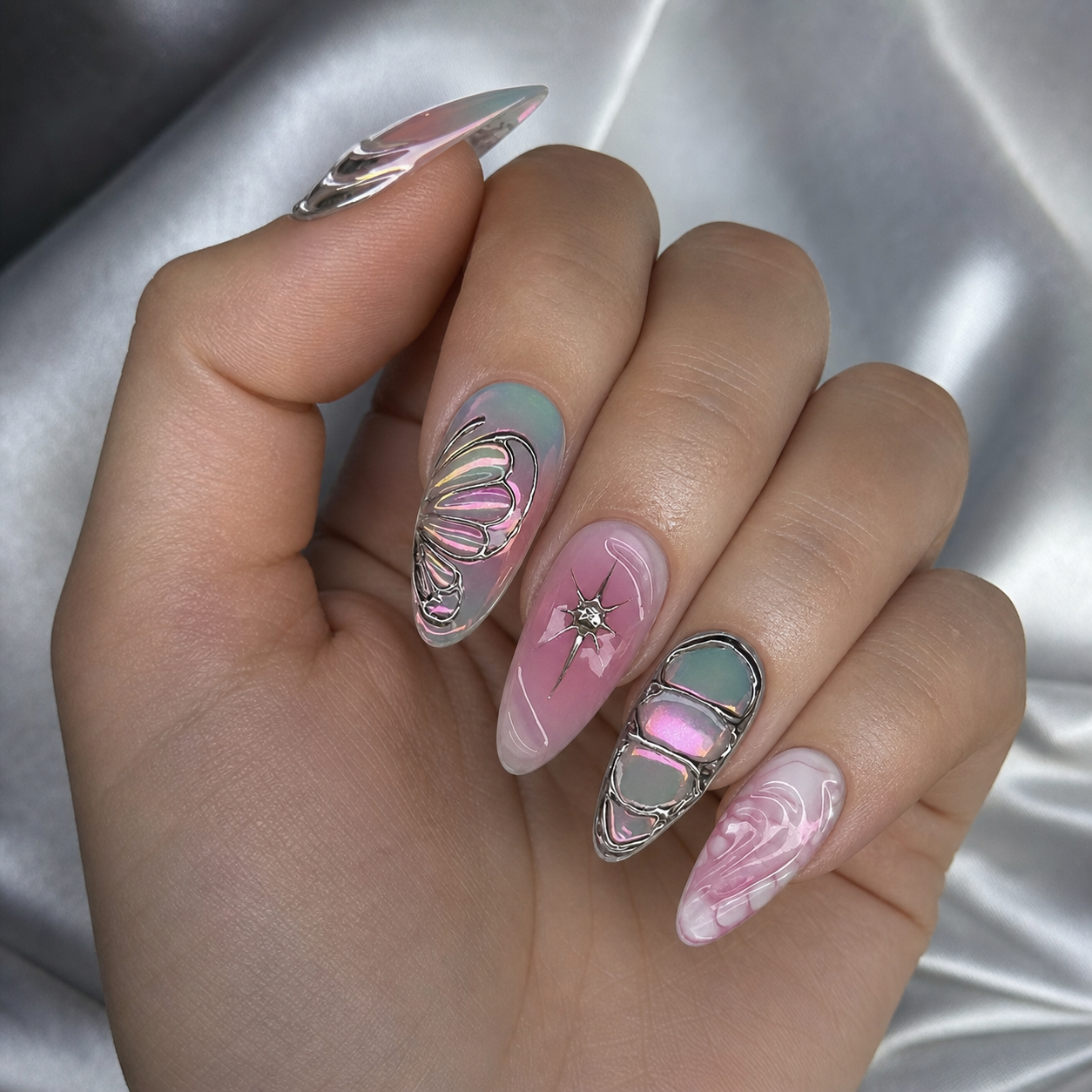 Model wearing silver chrome butterfly press-on nails