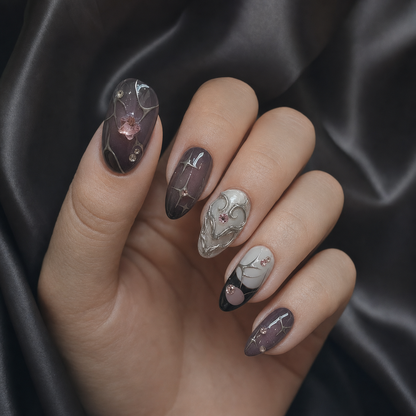 Model wearing smoky plum chrome rhinestone press-on nails